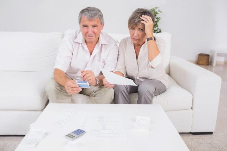 Image of a confused couple trying to work out their finances