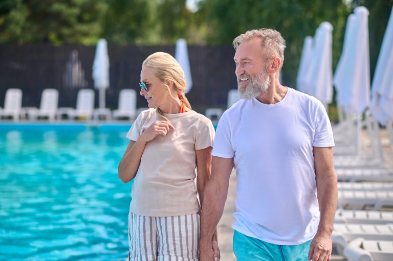 Couple on holidays at swimming pool